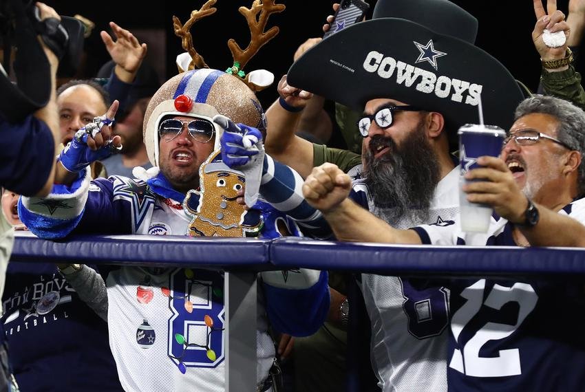 Dallas Cowboys fans cheer during the second half of a game against the Los Angeles Rams at AT&T Stadium.